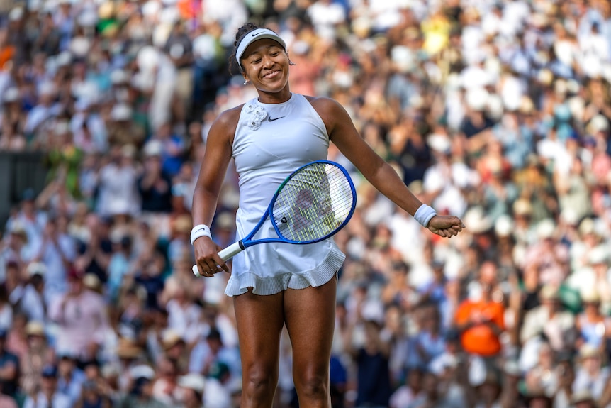 Naomi Osaka smiles after winning against Aryna Sabalenka