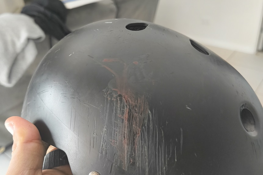 A helmet with significant scrapes