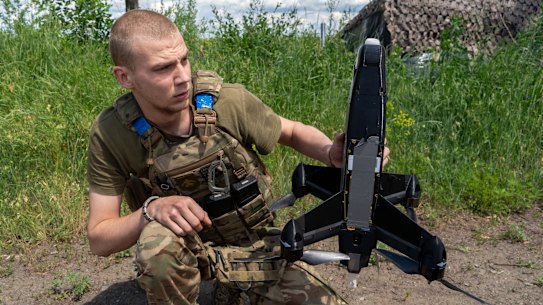 A Ukrainian soldier prepares to launch an interceptor drone in Kharkiv, eastern Ukraine.