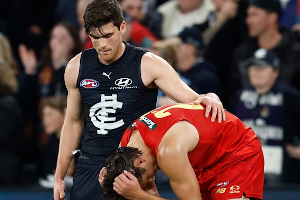 Carlton’s Lewis Young consoles his Suns’ opponent Ned Moyle