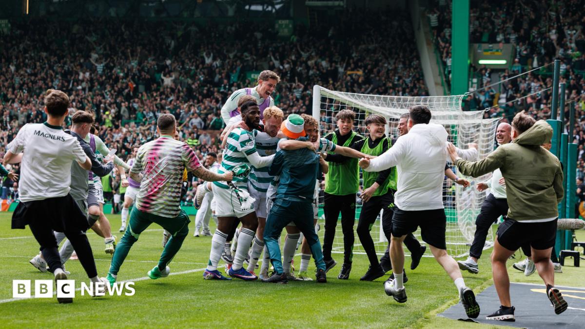 Celtic fans run on the pitch to celebrate a goal against Hearts, sparking a larger pitch invasion.