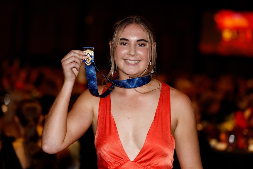 Zarlie Goldsworthy of the Giants poses for a photo after winning rising star award