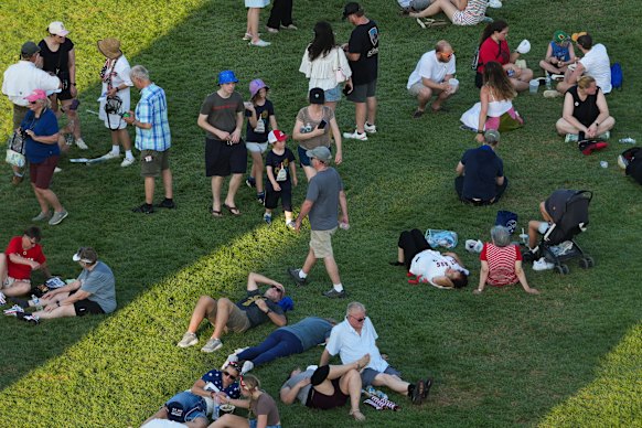 People rest in the shade at the Great American State Fair on Friday.