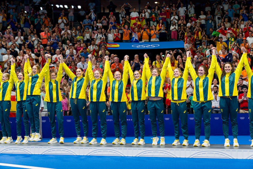 Australia's Stingers hold up their hands