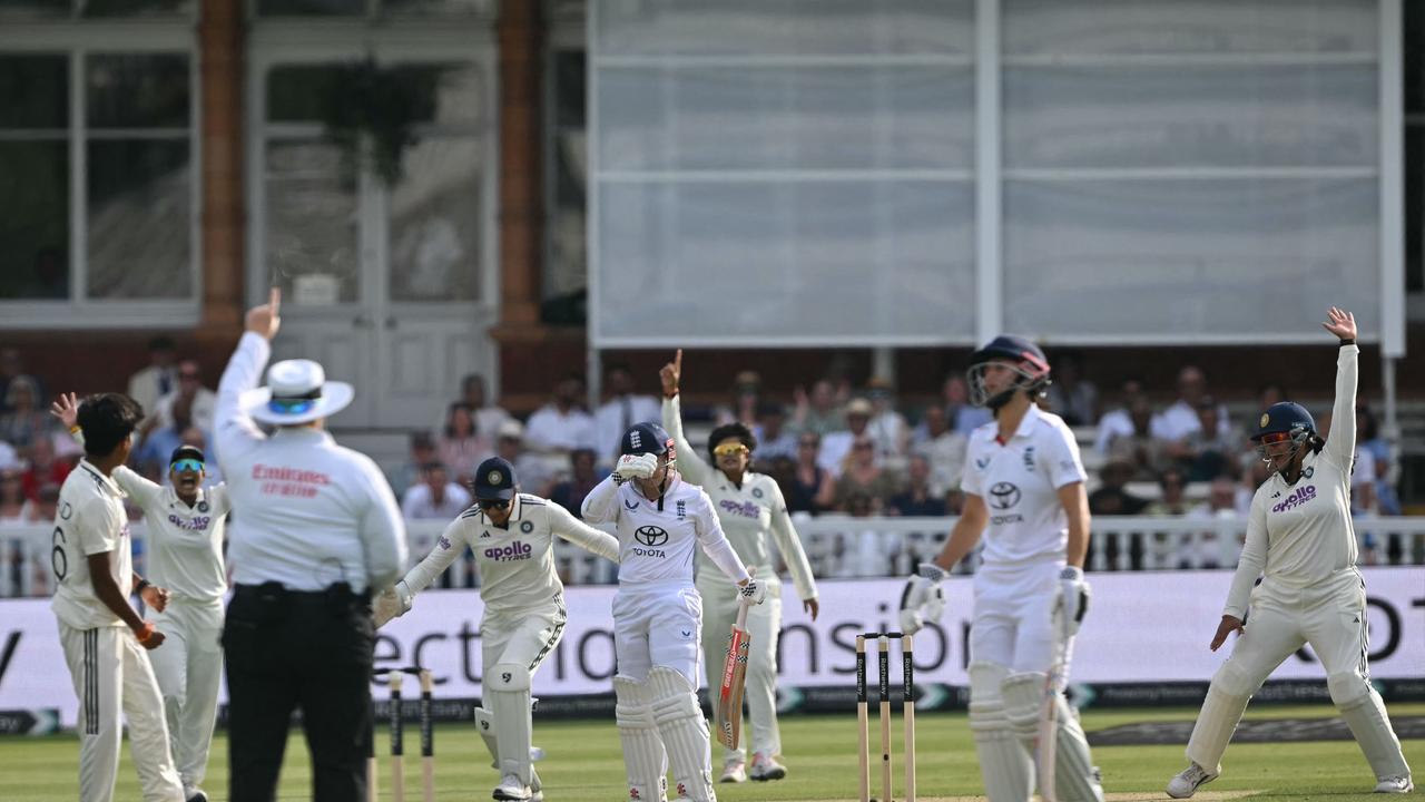 India's players celebrate as England's Tammy Beaumont is trapped LBW (leg before wicket) by a ball from India's Kranti Gaud on the first day of the first Women's cricket Test match between England and India at Lord's cricket ground in London, on July 10, 2026. (Photo by JUSTIN TALLIS / AFP) / RESTRICTED TO EDITORIAL USE. NO ASSOCIATION WITH DIRECT COMPETITOR OF SPONSOR, PARTNER, OR SUPPLIER OF THE ECB