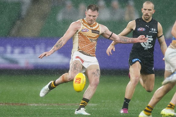 Blake Hardwick of the Hawks kicks the ball.
