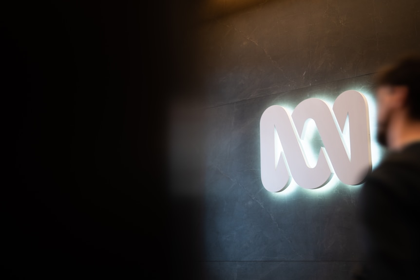 Corporate grey office building and ABC logo