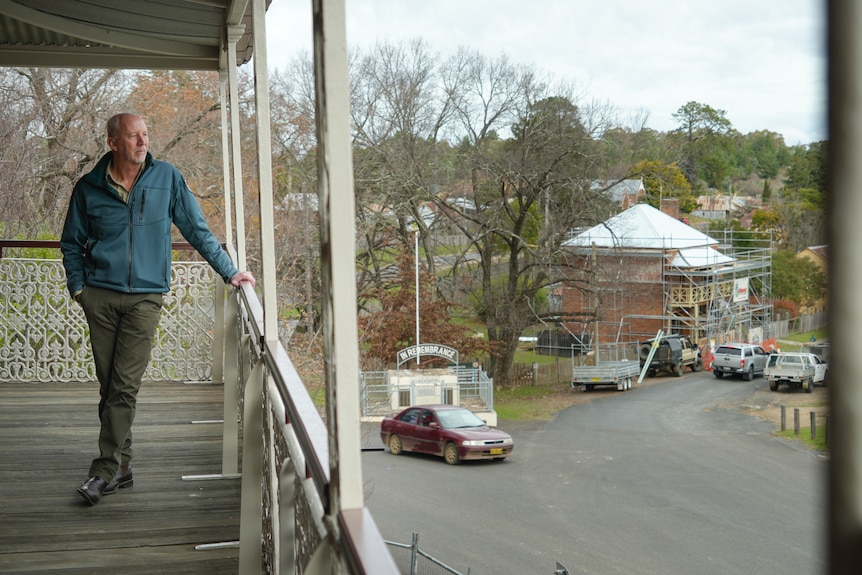 Man stands in an old heritage building being renovated.