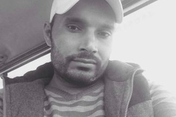 A black and white photo of a man, Dharminder.