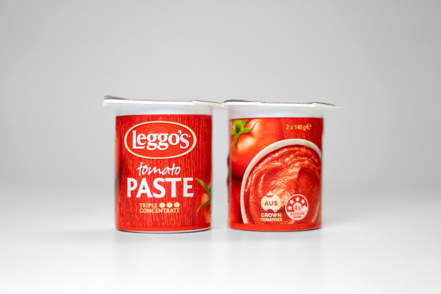 Two tubs of tomato paste against a white background. Their packaging includes a logo saying "Aus grown tomatoes".