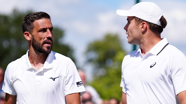 Arthur Fery and Damir Dzumhur in a tense exchange at the end of the match.