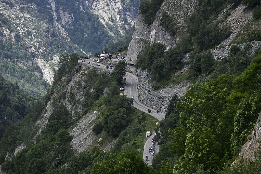 The pack of riders pictured in action during stage 20 of the 2026 Tour de France cycling race, a stage of 171km Le Bourg d'Oisans to Alpe d'Huez, on Saturday 25 July 2026. The 113th edition of the Tour de France starts on Saturday 4 July in Barcelona, Spain, and will finish in Paris, France on the 26th of July. BELGA PHOTO JASPER JACOBS (Photo by JASPER JACOBS / BELGA MAG / Belga via AFP)