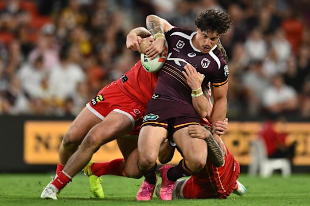 BRISBANE, AUSTRALIA - MARCH 27: Kotoni Staggs of the Broncos is tackled during the round four NRL match between Brisbane Broncos and Dolphins at Suncorp Stadium, on March 27, 2026, in Brisbane, Australia. (Photo by Albert Perez/Getty Images)