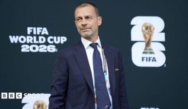 Uefa president Aleksander Ceferin in front of signage which reads Fifa World Cup 2026