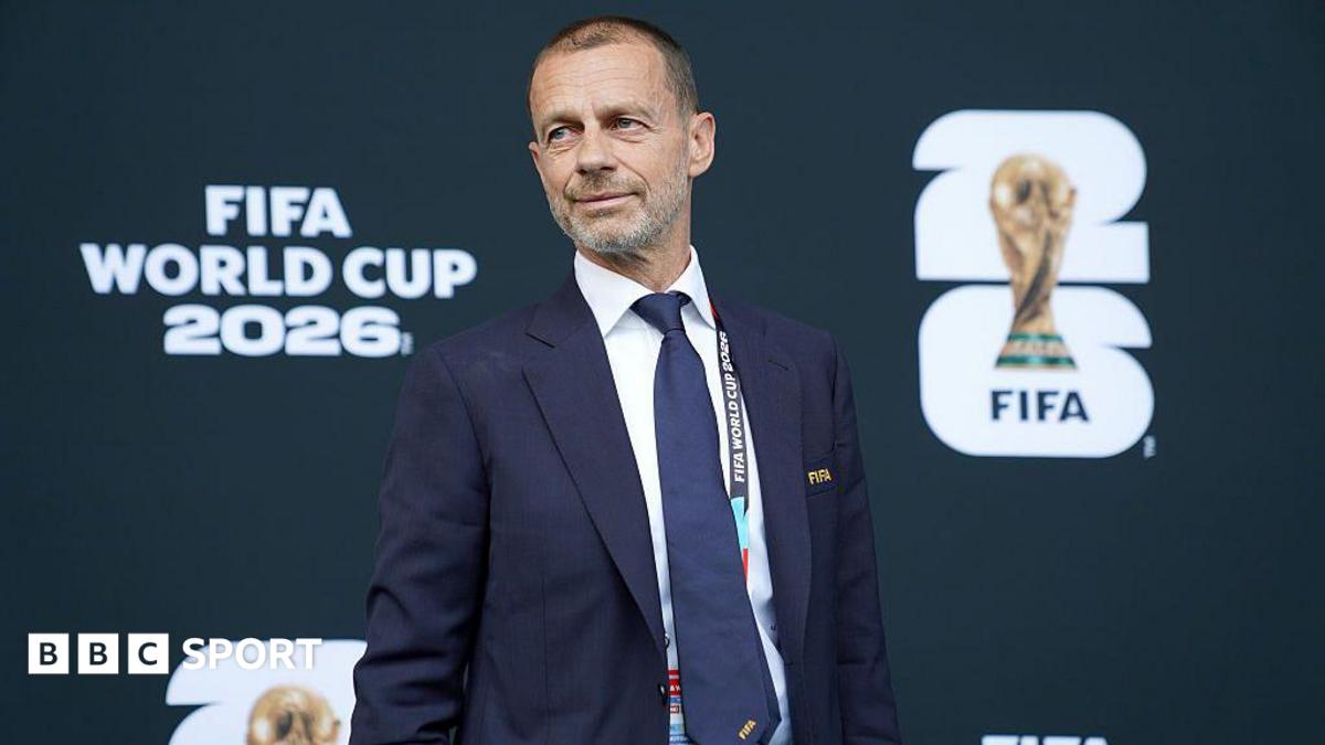 Uefa president Aleksander Ceferin in front of signage which reads Fifa World Cup 2026