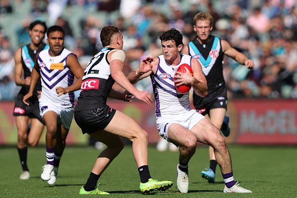 Andrew Brayshaw looks to get away from Logan Evans as Fremantle beat Port Adelaide on Saturday.