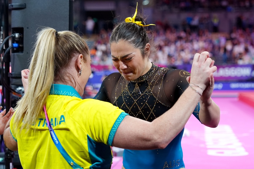 Georgia Godwin cries after her floor routine in the Commonwealth Games women's artistic gymnastics final.