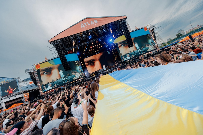 A big outdoor stage at a music festival.