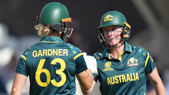 Australia’s Beth Mooney, right, celebrates her 50 runs with Ash Gardner.