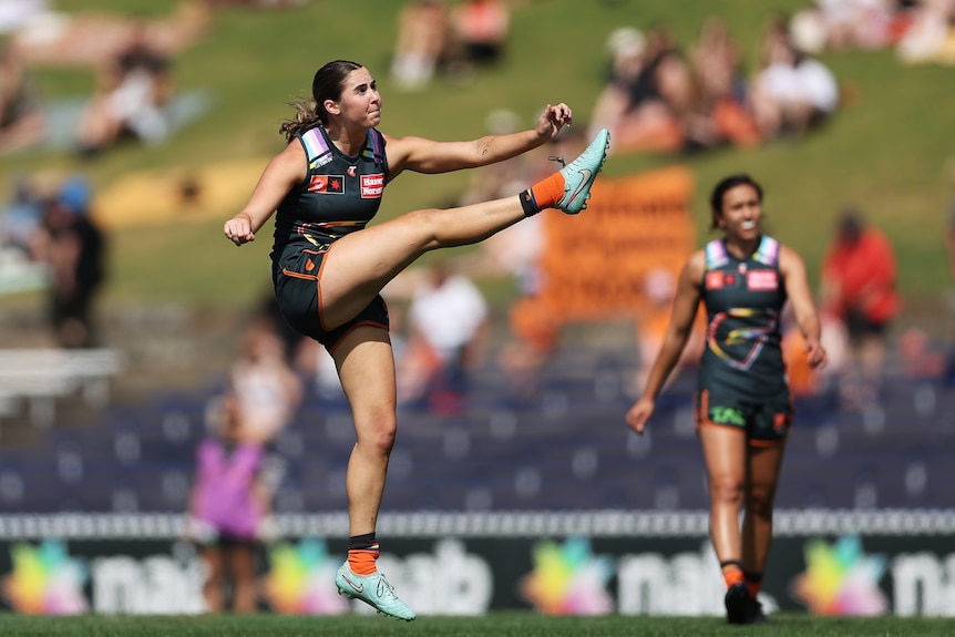 Zarlie Goldsworthy of the Giants kicks during a game.