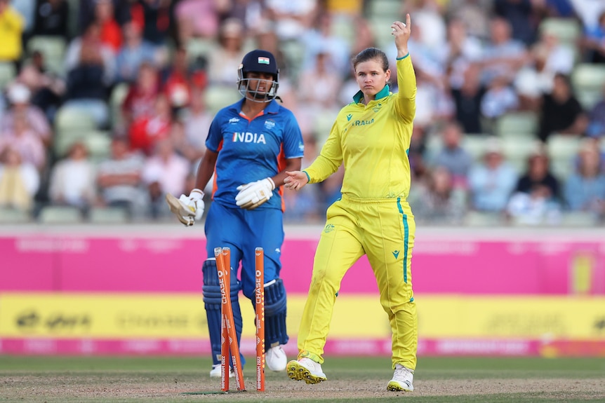 Jess Jonassen runs out Megnha Singh in the 2022 Commonwealth Games Twenty20 cricket final.