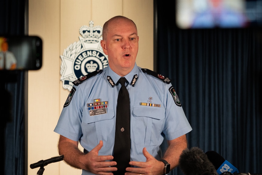 police officer talking in front of office