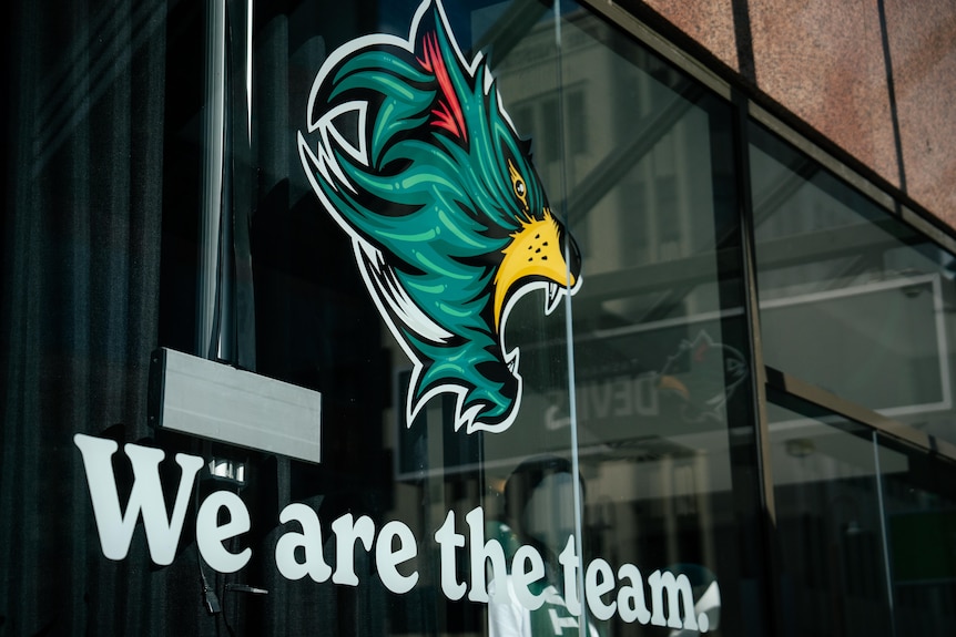 office fit out showing logos and slogans for Tasmania Devils AFL team