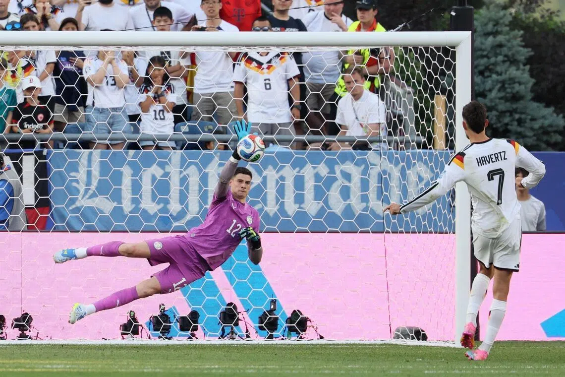Paraguay’s goalkeeper Orlando Gill saves the penalty kick by Germany’s forward Kai Havertz during the penalty shoot-out of the 2026 World Cup match between Germany and Paraguay on June 29.