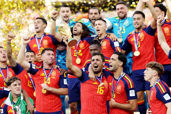 Rodri lifts the trophy as Spain celebrate their World Cup victory.