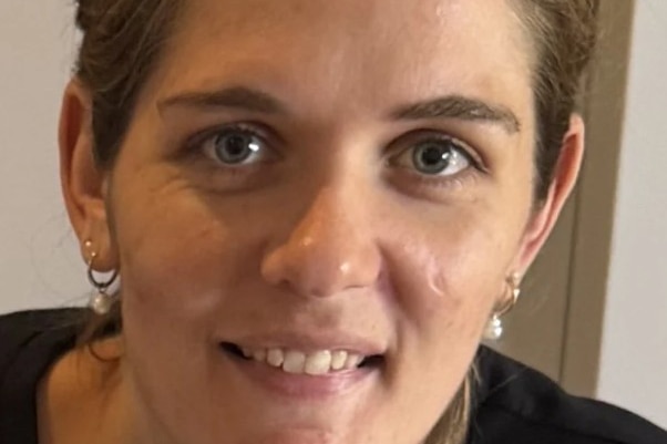 a close up image of a woman smiling