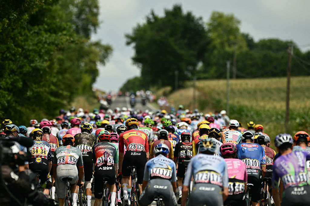 The pack of riders (peloton) cycles during the 7th stage of the 113th edition of the Tour de France cycling race, 175,1 km between Hagetmau and Bordeaux in southwestern France, on July 10, 2026. (Photo by Loic VENANCE / AFP)