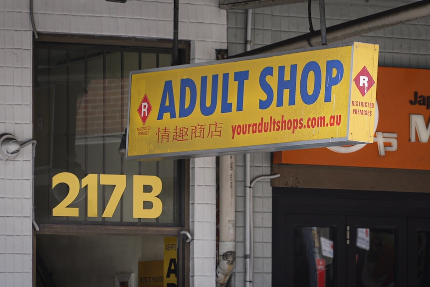 A sign outside an adult shop in suburban Sydney showing the "R" symbol and words "restricted premises".
