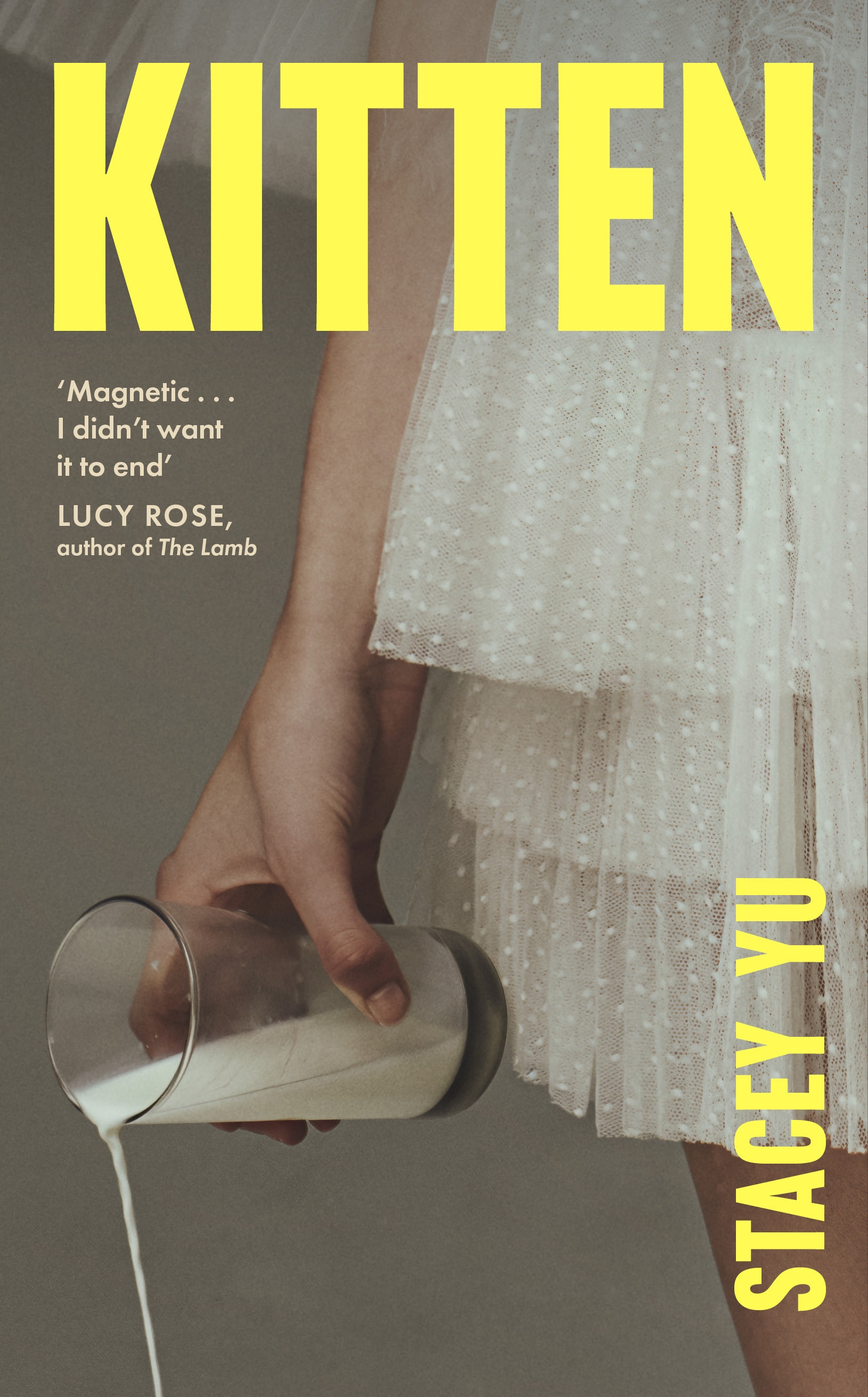 Cover of Kitten by Stacey Yu, showing a detail of a person in a white tulle skirt tipping milk out of a glass held by her side.