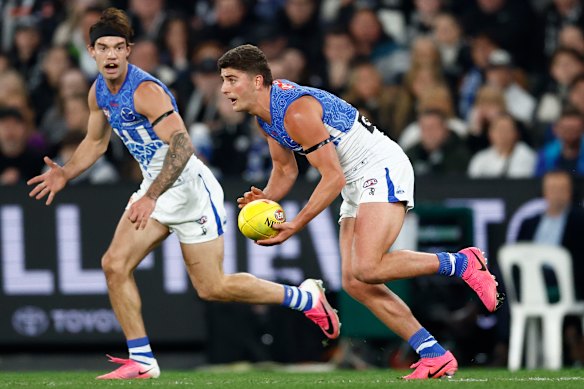 Harry Sheezel of the Kangaroos in action.