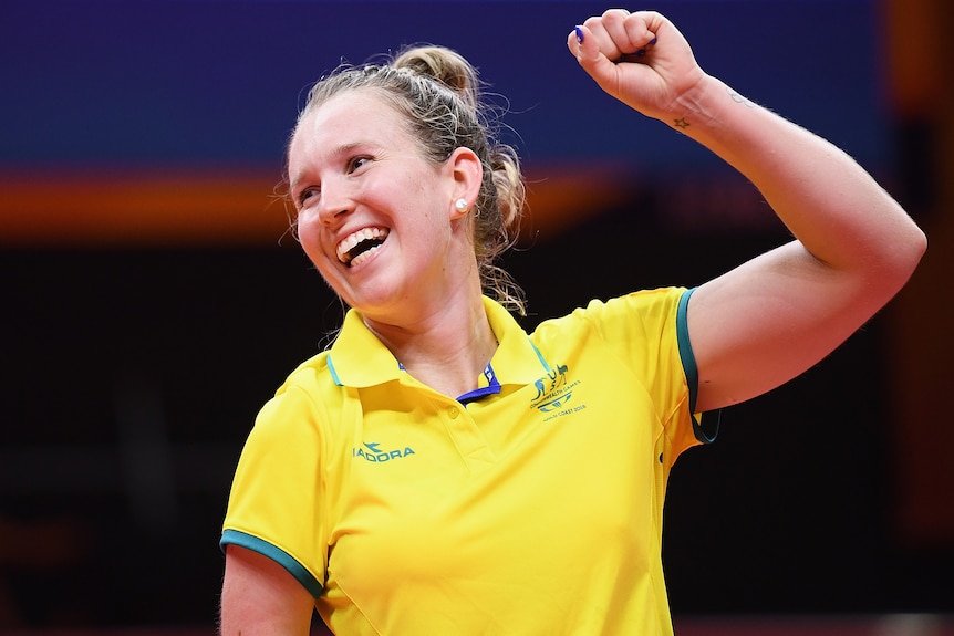 Melissa Tapper raises a fist to celebrate a gold medal in Gold Coast 2018 Commonwealth Games.