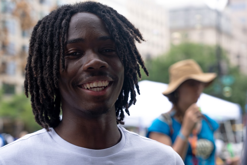 Muarib Abdul-Tawwab smiles at the camera.
