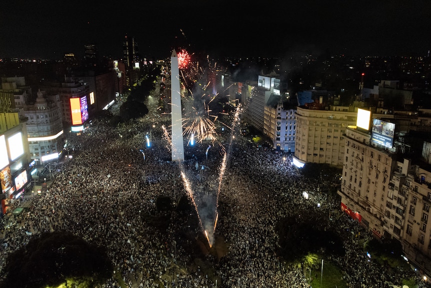An aerial shot of a main boulevard in Buenos Aires filled with fans celebrating.