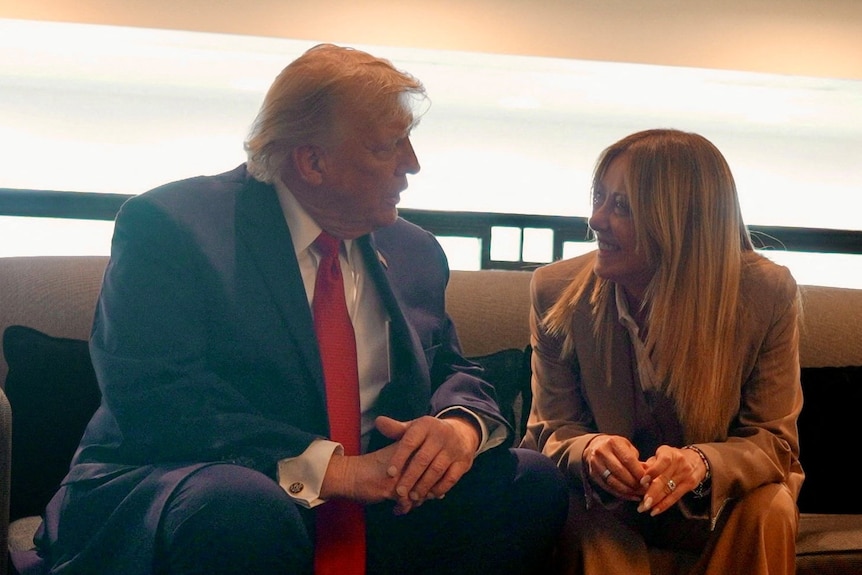 Donald Trump and Giorgia Meloni sitting down and talking