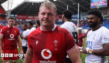 Wales hooker Dewi Lake in the foreground as Fiji players applaud off the Wales team at Cardiff City Stadium