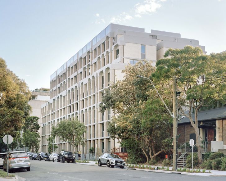 The design’s quirky neoclassical details set the project apart from the typical post-industrial residential builds of the area.
