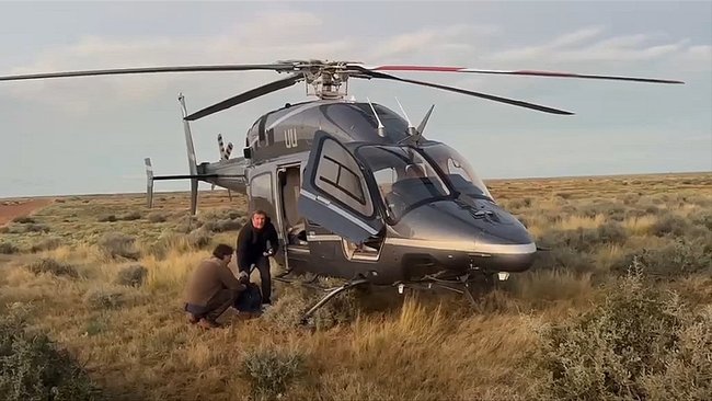 A Melbourne father and son have been rescued by billionaire Tim Roberts in the SA outback.