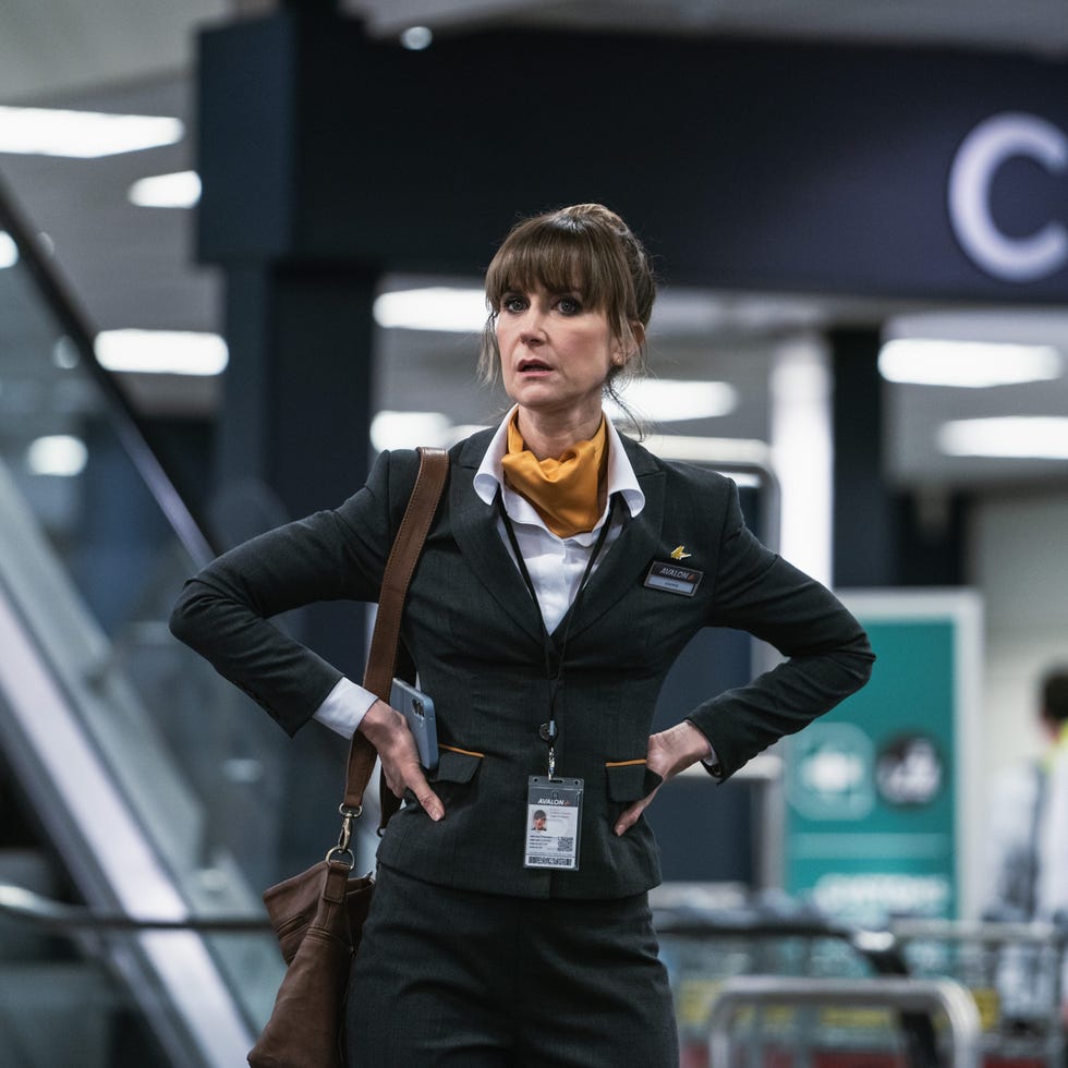 airline staff member in a uniform at an airport airline staff member in a uniform at an airport