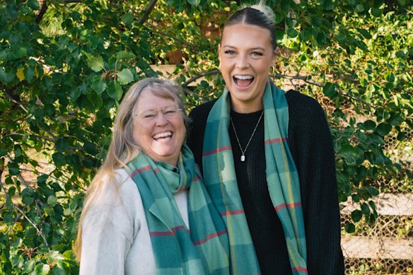 Tasmanian Devils VFLW player Ebony McGinness with her mother in the limited edition Waverley Mills scarf.