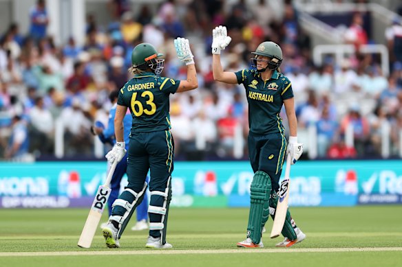 Ash Gardner celebrates her semi-final half-century with Ellyse Perry.
