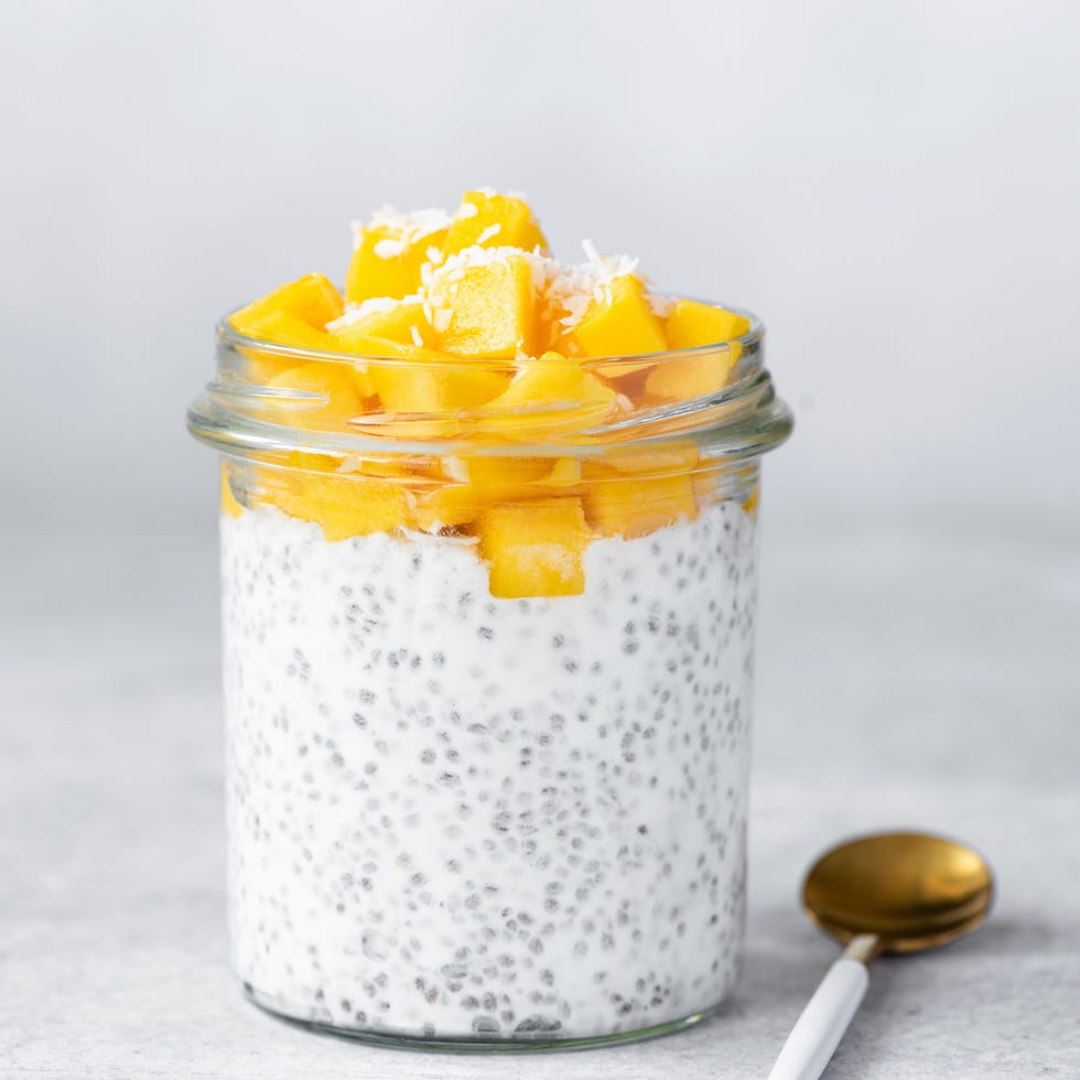 Close up of chia seed pudding topped with mango pieces in jar Close up of chia seed pudding topped with mango pieces in jar
