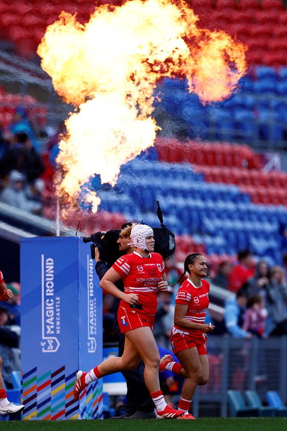 Dragons Hannah Southwell and Nita Maynard-Perrin run out for the inaugural NRLW Magic Round in Newcastle in 2025.