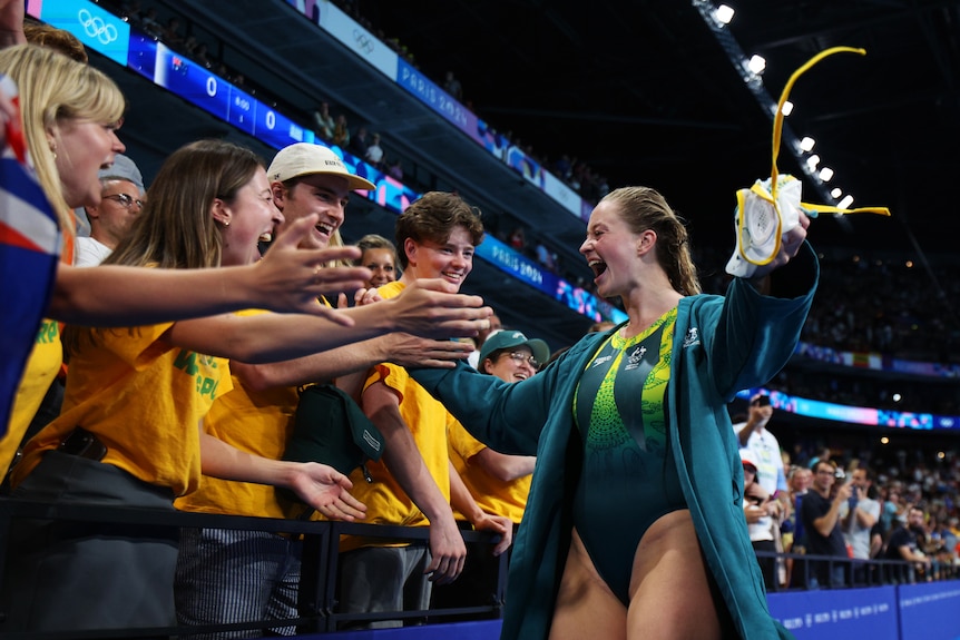 Abby Andrews celebrates with supporters