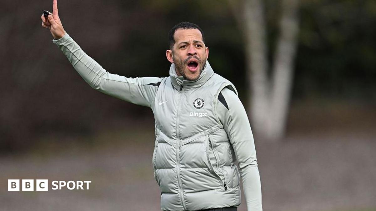 Liam Rosenior points to the sky while delivering instructions to his players during Chelsea training
