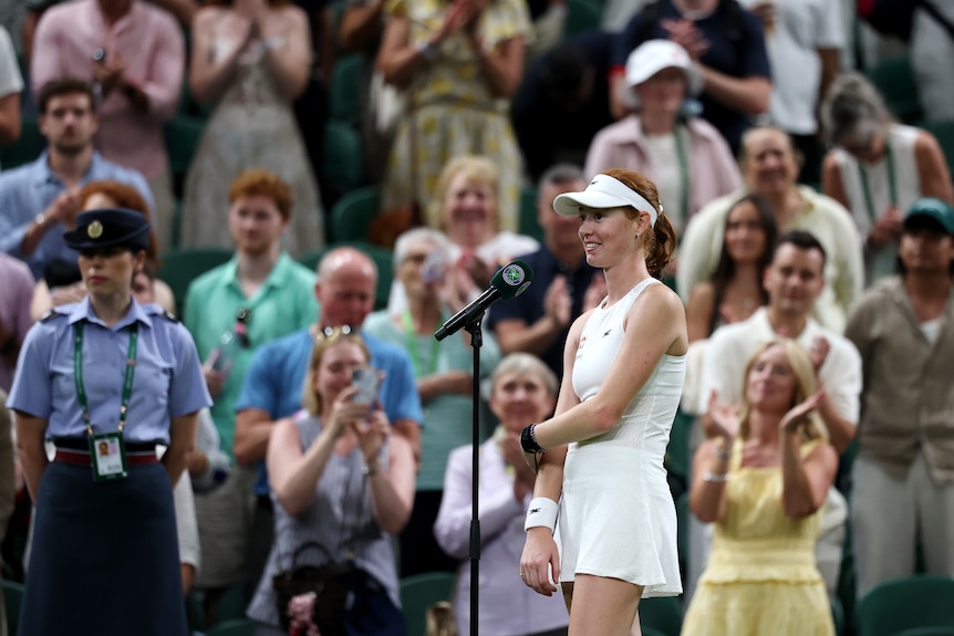 Maya Joint speaks on centre court at Wimbledon.