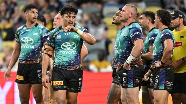 North Queensland players stood under the posts a lot during an 82-12 massacre by Sydney Roosters. 